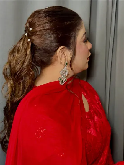 A view of the chic ponytail hairstyle with pearl accessories that I created to go with this soft glam makeup.