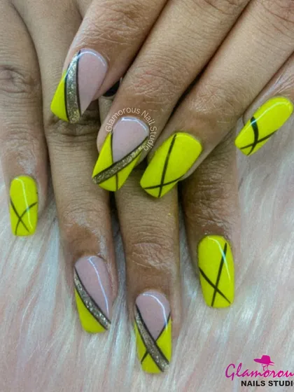 Sharp, modern, and geometric. This design uses a vibrant yellow base and adds a dynamic pattern of intersecting black lines. Accent nails with a nude base and a touch of glitter complete this edgy look.