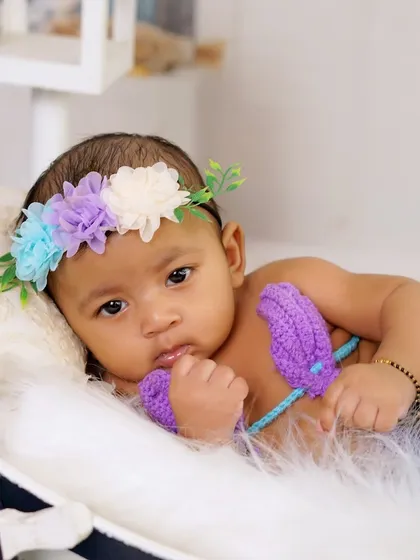 A sweet close-up of the baby in her mermaid costume. Her expression is just priceless.
