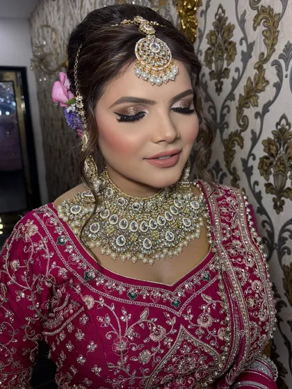 A close-up of a bride with a soft brown smokey eye and a nude lip. This look is perfect for the bride who wants elegance and sophistication.