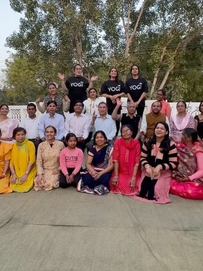 A happy group photo after a community yoga session in Jhunjhunu. The energy of practicing together under the open sky is truly special.