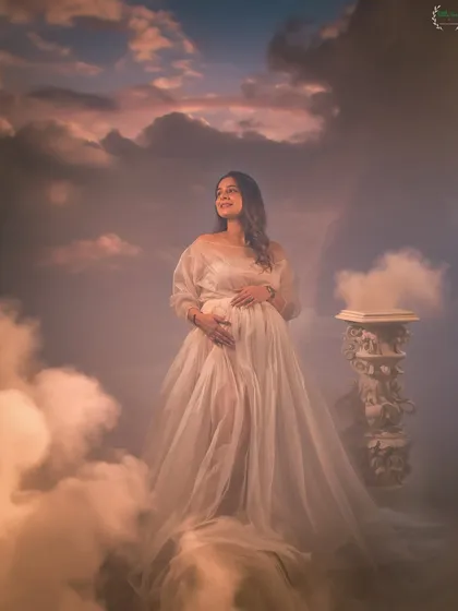 Let's create a scene as heavenly as this feeling. Using creative setups like this cloud-filled dreamscape, I can turn your maternity photos into a piece of surreal and beautiful art.