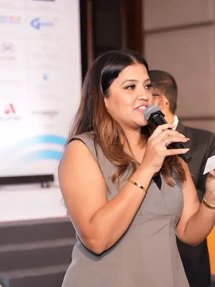 A candid shot of me interacting with someone on stage during the PPL Conclave.