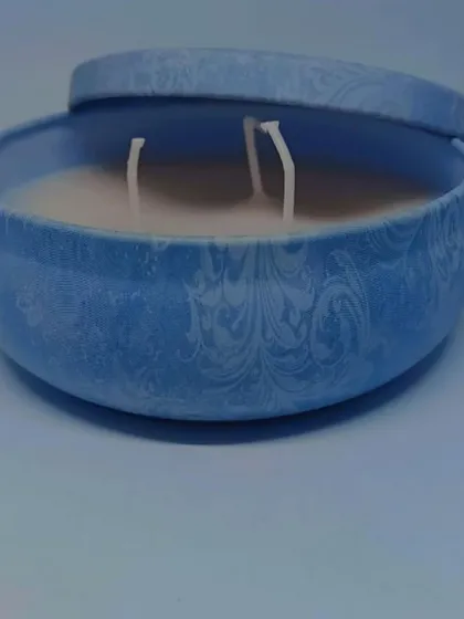 This is one of my larger tin candles, featuring a subtle embossed pattern and three wicks for a stronger scent throw and an even burn.