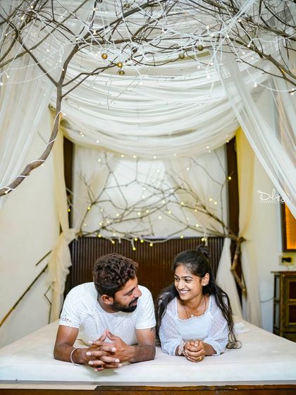 A playful and happy moment on our indoor bed set, perfect for capturing a couple's personality.
