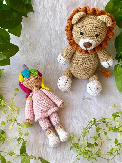 This large lion in a soft beige color is so huggable. His gentle expression and soft mane make him a comforting friend for children.