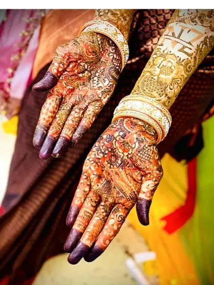 This is the beautiful, rich stain you can expect from my organic henna. This photo, taken after the paste was removed, shows the deep color and how the design, including the couple's initials, looks with bridal bangles.