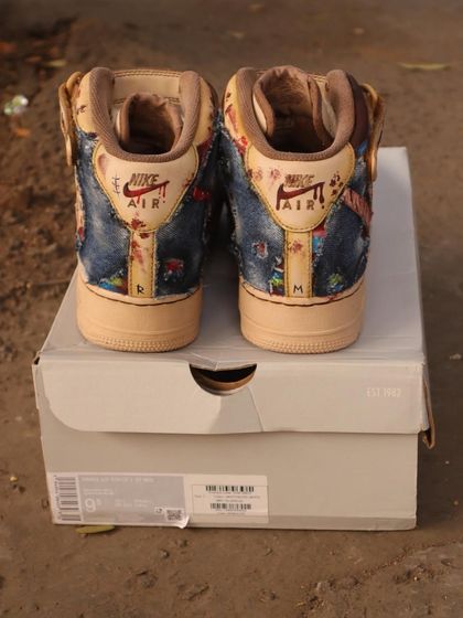 The back view of the Chucky AF1 Mids. I continued the denim dungaree and blood-spatter theme onto the heel, adding my initials "R" and "M" for a personal touch.