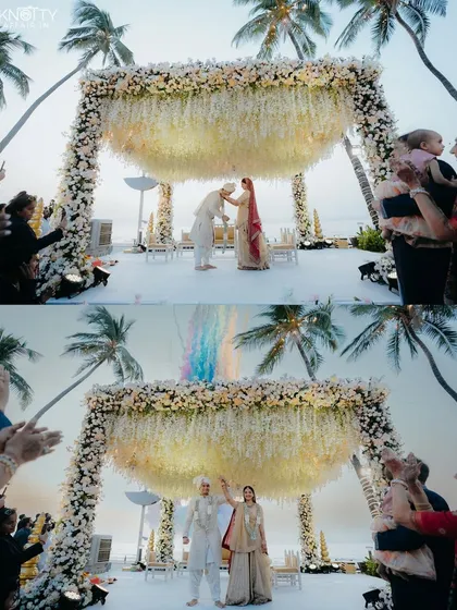 The perfect beach wedding mandap, set against the open sky and swaying palm trees. This shot captures the scale and beauty of a destination ceremony, where the natural environment becomes an integral part of the wedding decor and memories.