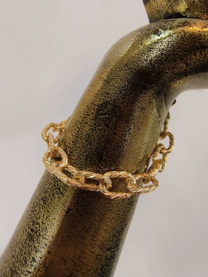 A close-up of the anti-tarnish chain link bracelet from the set.