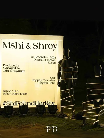 A unique and edgy welcome installation, featuring a vogue-style magazine cover design and mannequins wrapped in lights. This is for the couple that wants to make a bold statement.