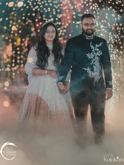 A dreamy entrance for the couple. The combination of ground fog and the bokeh from a thousand fairy lights creates a truly magical and cinematic effect.