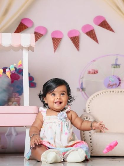Welcome to candy land. This sweet theme with a candy cart and pastel colors is perfect for a fun and cheerful baby photoshoot.