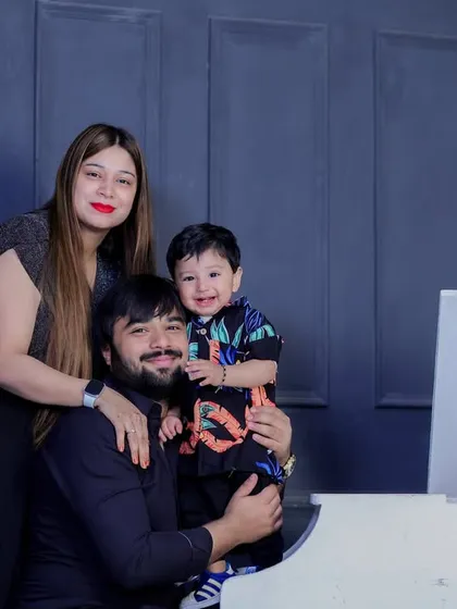 Another happy family enjoying the white piano setup. It's a versatile prop that adds a touch of class to any studio family session.