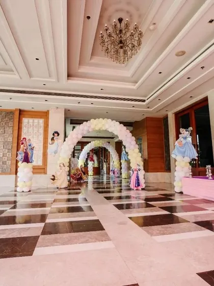 Here is a wider view of the princess-themed entrance hall. The series of balloon arches created a beautiful walkway, making the journey to the main party area an experience in itself.