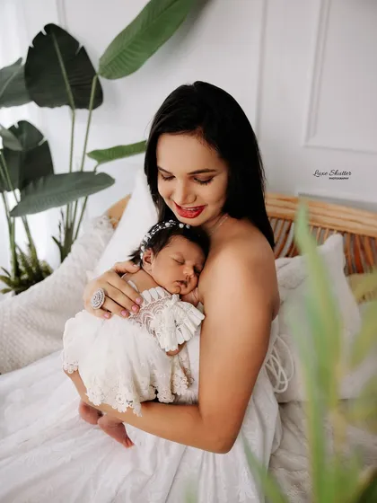 A tender moment between mother and child, set against a clean, bright backdrop. These portraits highlight the simple beauty of your connection.