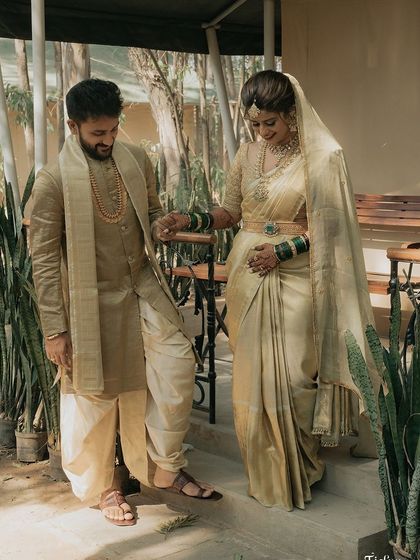 Bride Sanghavi and her partner during their muhurtham. She wears a classic gold Kanchivaram with a matching custom blouse for a timeless bridal look.