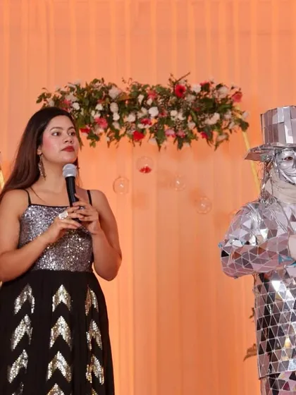 Another angle of me hosting alongside the mirror man performer. Keeping the show engaging requires coordinating with all event elements.