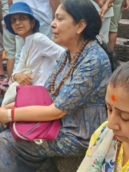 A fellow seeker sits in contemplation, absorbing the ancient energies of the Pashupatinath temple grounds.