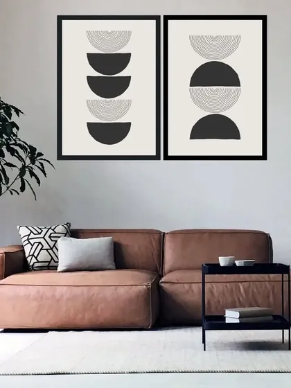 A bold, graphic set of two framed prints featuring stacked semi-circles in black and white. This vector-style abstract art is perfect for creating a modern, high-contrast look in your home.