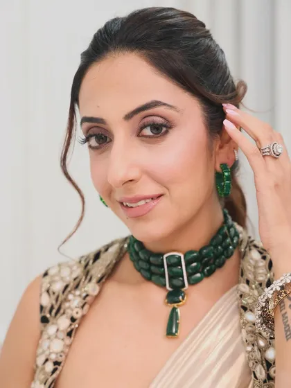 A different angle of the soft ponytail. This hairstyle is perfect for showcasing a statement necklace and earrings, keeping the hair away from the face in a stylish way.