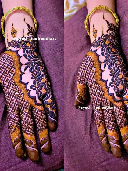 A modern and bold henna design featuring a striking checkerboard (jaal) pattern on the palm, contrasted with delicate floral work on the wrist. This shows how we can play with different textures and styles for a unique look.
