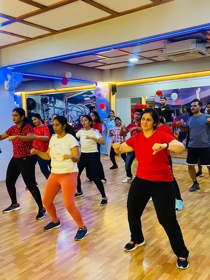 Our instructor, dressed in a Santa hat, leads the Christmas-themed dance routine. It was a fun and festive way to get a great workout before the holidays.