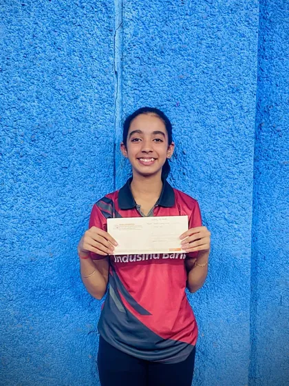 Hrithika Madhur holding her prize after winning a bronze medal in the U-19 girls' category at the Maharashtra State Championship in Pune.