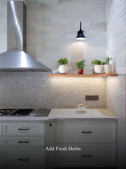 When styling kitchen shelves, I think of them as little stages for everyday joy. Adding fresh herbs brings life and fragrance to the space, keeping inspiration close at hand.