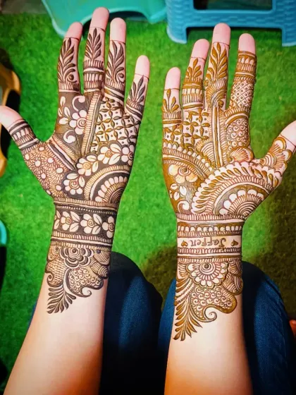 A lovely floral and geometric design with a personalized touch, featuring the name "Jaffer" on the wrist.
