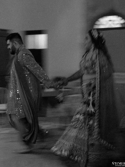 A black and white motion-blur shot of the couple, capturing a fleeting, artistic moment.