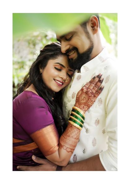 A tender and intimate moment between the couple, captured in a quiet corner during their engagement festivities.