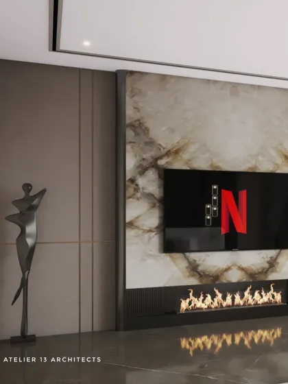 A close-up of a modern media wall featuring a book-matched marble slab and an integrated electric fireplace. This detail highlights our ability to seamlessly blend technology with natural, luxurious materials.