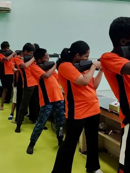 Campers practicing their holding technique in a line. This fundamental drill, which I include in all beginner camps, is crucial for building the stability and muscle memory required for accuracy.