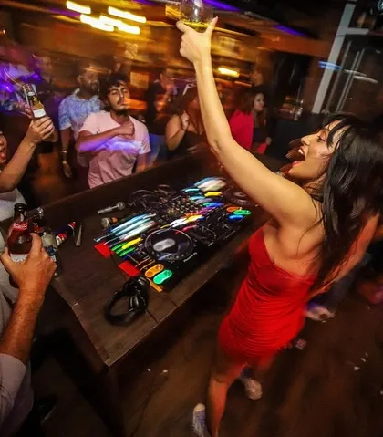 It's more than just a party; it's a celebration. Raising a glass with the crowd in the middle of a high-energy set. These are the moments that turn into memories.