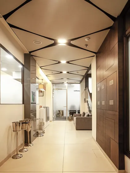 A seamless blend of contemporary design. Clean lines, refined wooden accents, and glass elements come together to create an office entrance that reflects sophistication and intent.