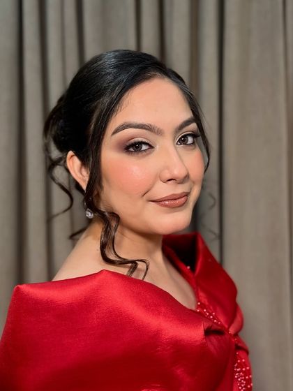 Jasleen, looking chic and elegant for her cocktail party. The makeup is sophisticated, with a defined eye and a neutral brown lip.