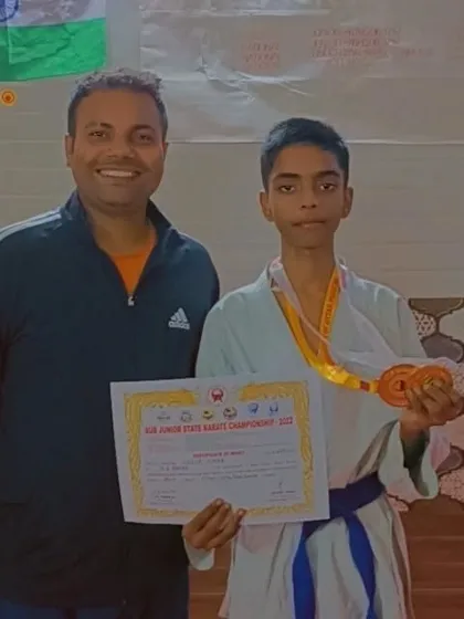 Another shot of our state champion Shiva, proudly displaying his gold medal and certificate.