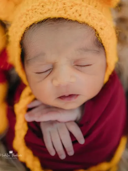 A close-up on the star of the show. His sleepy little face and tiny hands are just the sweetest details to capture.