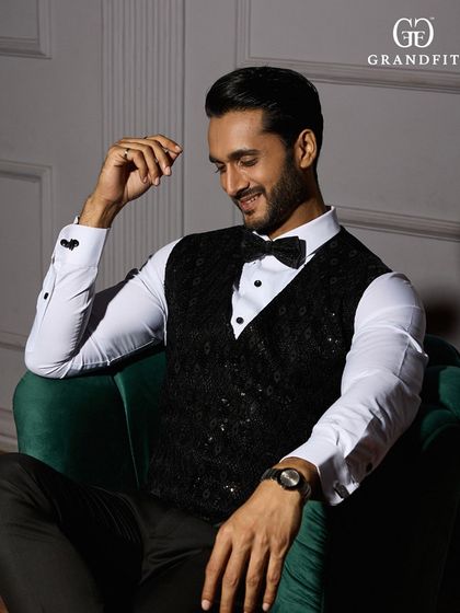 For a truly unique black-tie look, we offer custom waistcoats. This sequined piece adds a touch of personality and flair while remaining impeccably formal.
