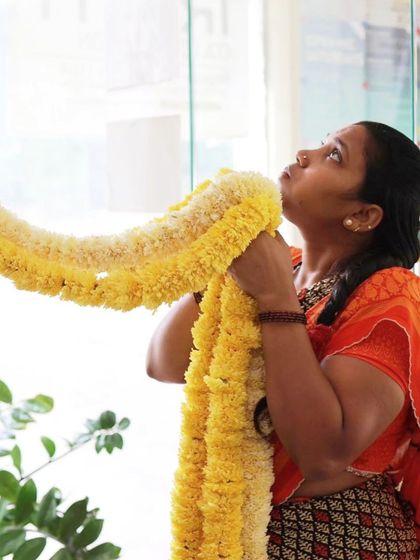 Our team member hanging flower garlands.