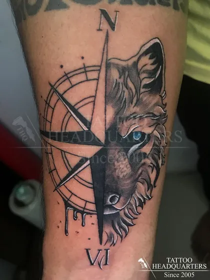 This wolf and compass piece is an example of our black and grey realism work. We focus on capturing sharp details and creating a design that has both meaning and impact.