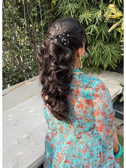 A side view of the pearl-studded textured ponytail, showing how it catches the sunlight.