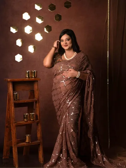 A beautiful solo portrait in the Shining Diva setup. Her smile is radiant, and the sequin saree catches the light perfectly.