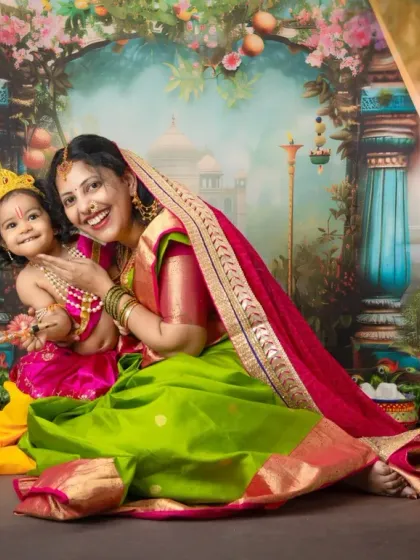A joyful moment captured during our Janmashtami mini sessions. The vibrant colors of the saree and the backdrop come together to create a festive and lively portrait.