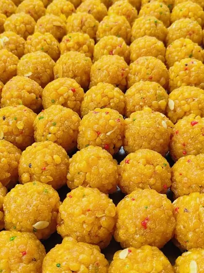 A tray full of freshly made Moti Bundi Laddoos. The vibrant colour and rich texture are a testament to the pure ingredients and traditional methods I use in my kitchen.