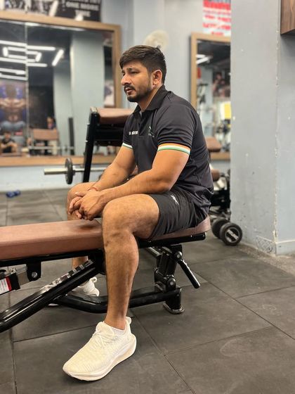 Taking a brief rest between sets. The gym is where we build the raw strength that translates to speed and power on the field.