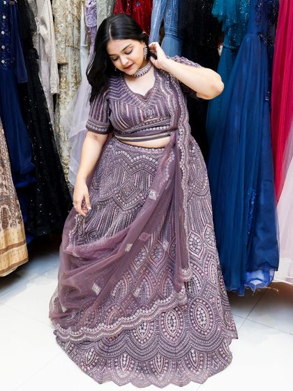 Dripping in charm and intricate details, this violet lehenga is pure magic. This shot shows the full detail of the embroidery.