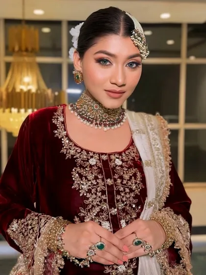 Regal elegance inspired by Heeramandi. This look features a luxurious maroon velvet suit, heavy jewellery, and classic makeup with a modern twist.