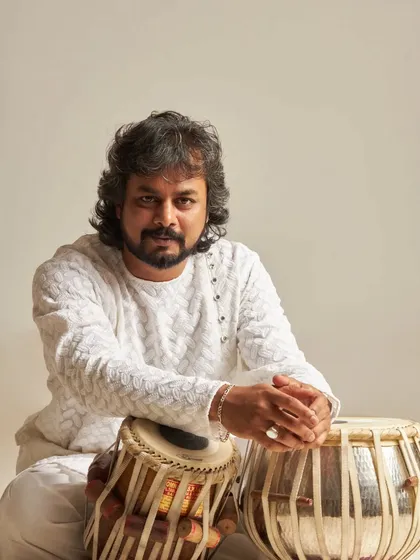 A relaxed portrait with my tabla. This photo reflects my calm and approachable nature, which I hope comes through in my music and collaborations.